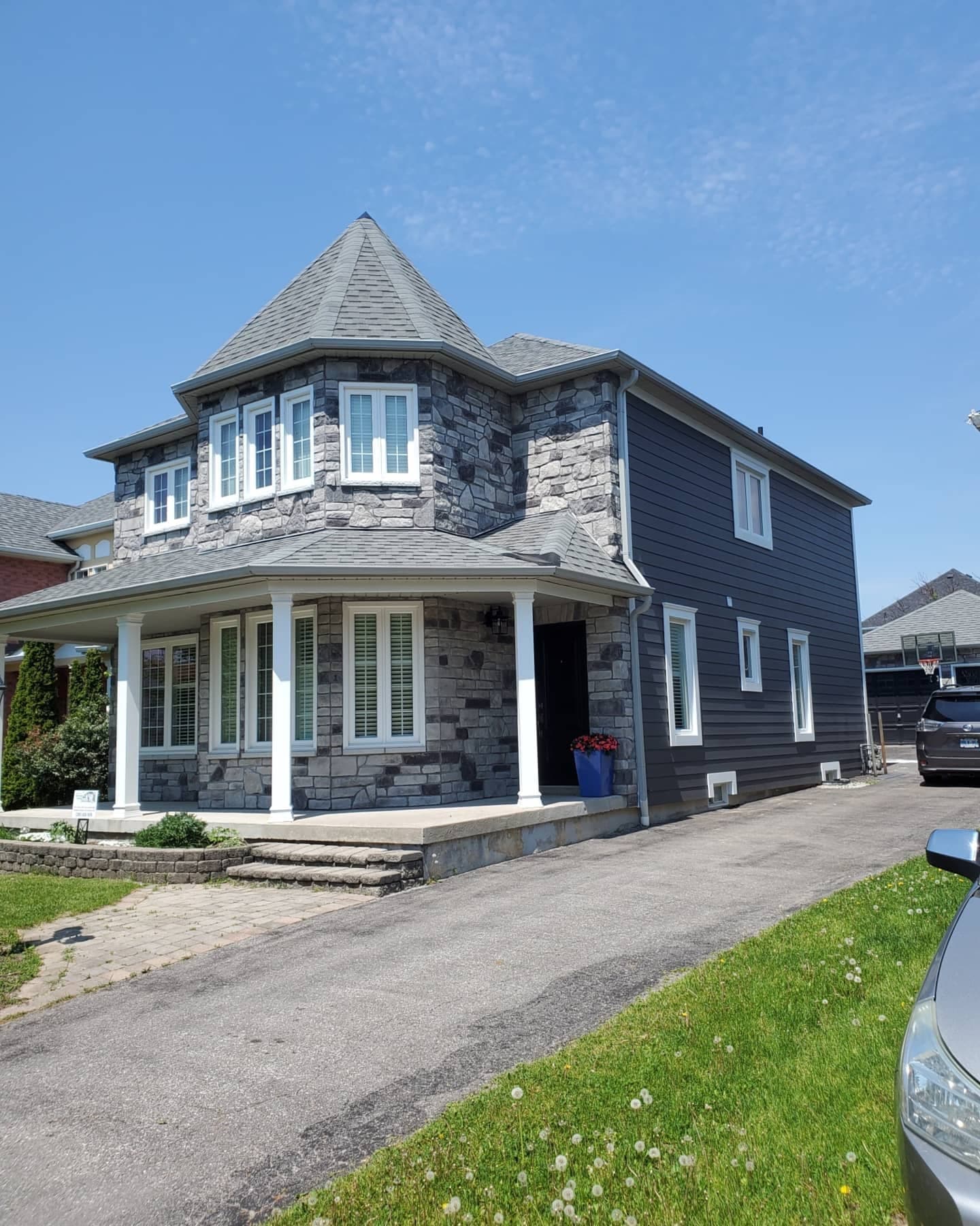 Royal Celect Wrought Iron pvc trim and siding with a stone front