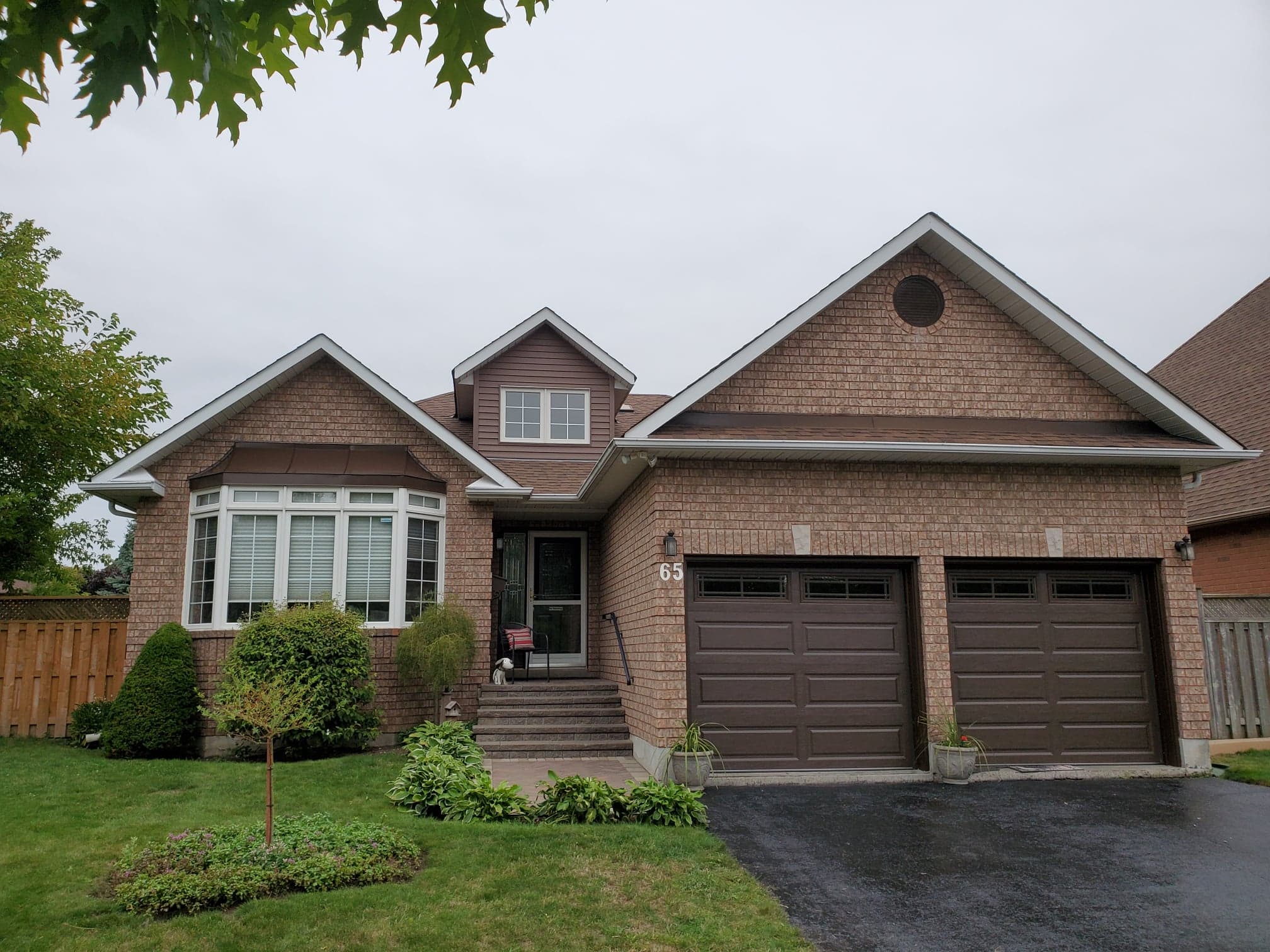 image of brown vinyl siding and garage doors